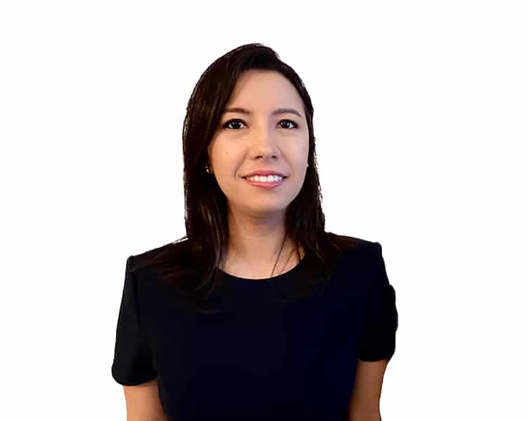 A professional corporate headshot of a smiling woman with shoulder-length dark hair, wearing a short-sleeved black top against a plain white background.